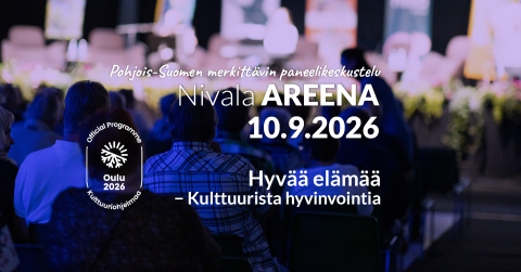 Kuvassa tapahtumayleisö istumassa katsomossa